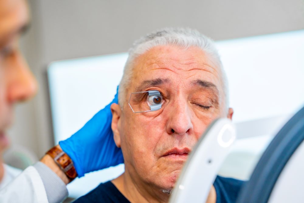 Patient's eye opened for scan in hospital