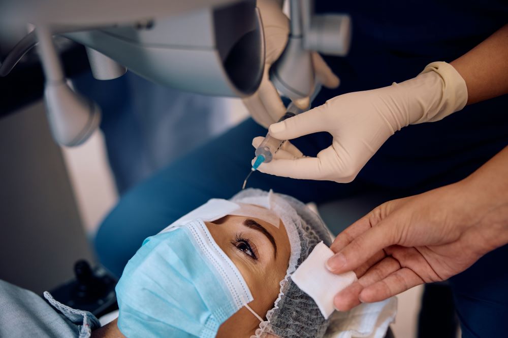 Doctor performing laser surgery on women