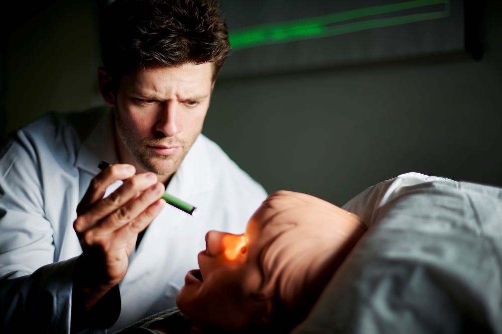 doctor examining patient after surgery